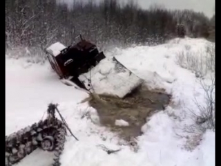 tractor goes under the ice