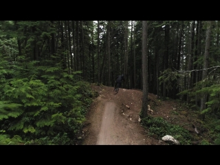 the coolest cyclist on a cool bike rides on a steep track